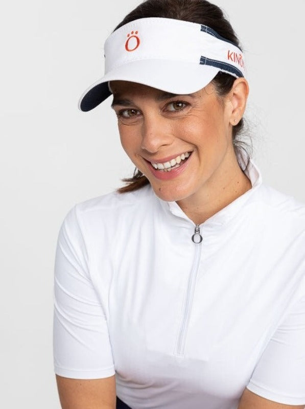 Front view of a smiling woman wearing a white No Hat Hair Visor and a Keep It Covered Short Sleeve Golf Top in white/white