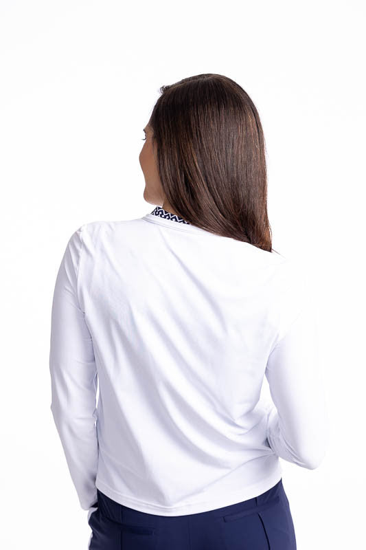 Back view of the Zip It Up Party Cardi in White. This is a solid white cardi with a zip front, two pockets (one with built-in tee holders), and a rounded neckline.