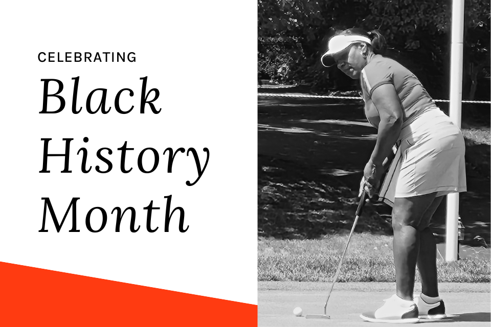 A female golfer representing Black History Month standing and sinking a putt.