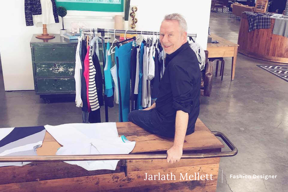KINONA's fashion designer Jarlath Mellett smiling at a measurement station.