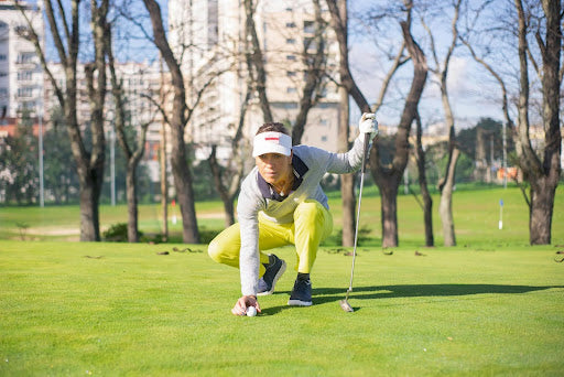 Woman Lining up Golf Shot