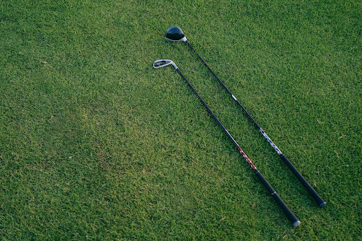 Two Golf Clubs Side by Side