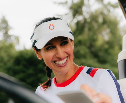 A woman wearing Kinona golf attire