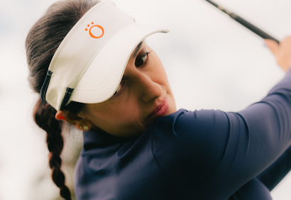 A woman playing golf