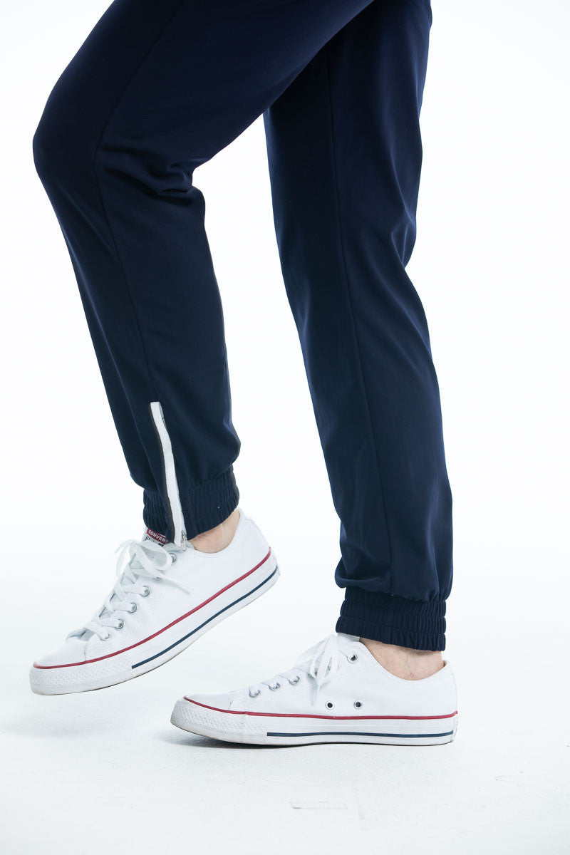 Closer side view of the Apres 18 jogger pants in navy blue