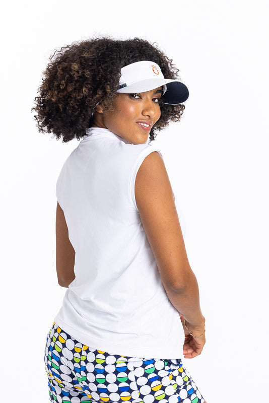 Woman looking over her right shoulder wearing a Light and Lovely sleeveless golf top in white and a white No Hat Hair Visor