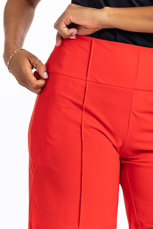 Right side view of the Tailored and Trim golf shorts in cherry red