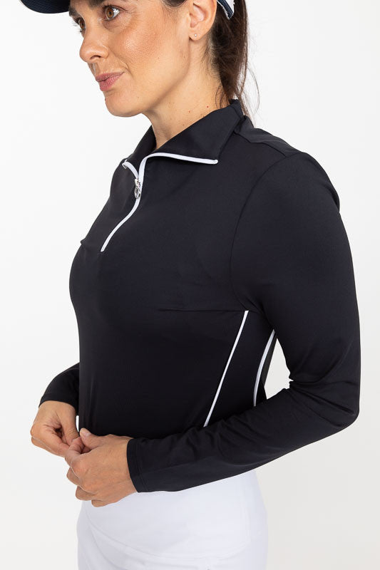 Front and left side view of a woman wearing a Keep It Covered Long Sleeve Golf Top in black
