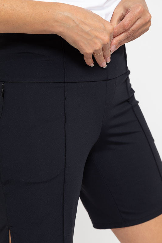 Front and right side view of a pair of Tailored and Trim Golf Shorts in black