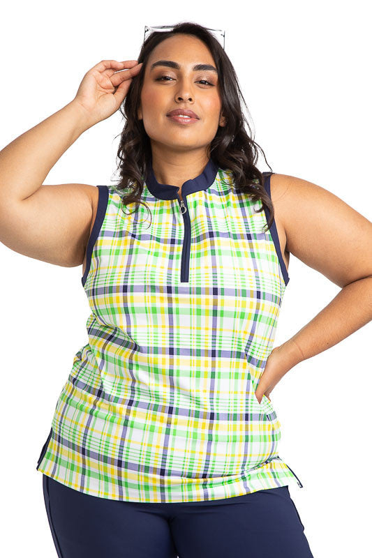 Woman wearing the Zip It and Rip It Sleeveless Golf Top in Picnic Plaid. This plaid includes white, navy blue, yellow, and green in the print.