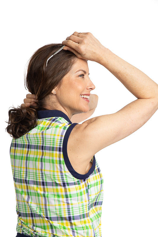Back and right shoulder view of the Zip It and Rip It Sleeveless Golf Top in Picnic Plaid. This plaid includes white, navy blue, yellow, and green in the print.