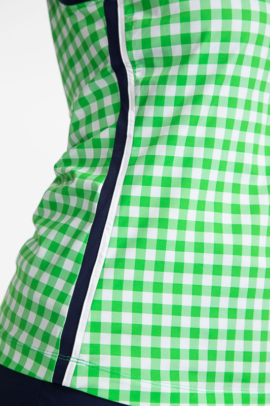 Close side view showing the navy blue and white stripe that runs down the side of the On Par Sleeveless Golf Top in Go Go Gingham. This print consists of green and white checks with navy blue and white accents along the neckline, down each side of the top