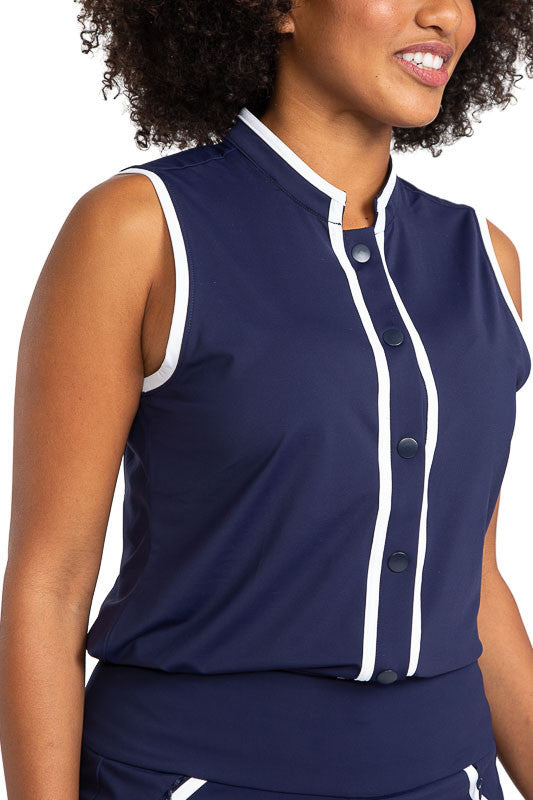 Closer front view of the Looking Snappy Sleeveless Golf Top in Navy Blue. This top also has white accents around the collar and down the front of the top and around each armhole.