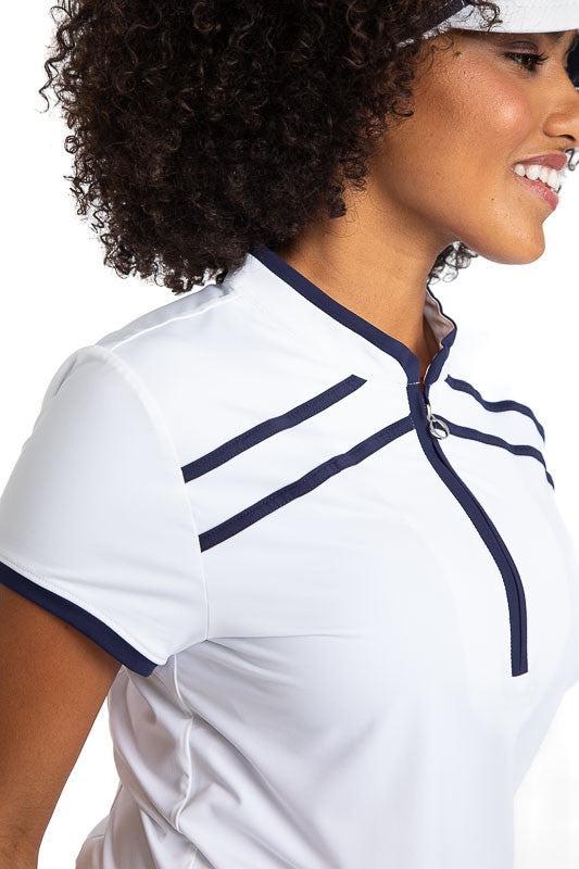 Close right front side view of the Gimme Putt Short Sleeve Golf Top in White. This top has navy blue accents along both sides of the zipper, two stripes horizontally across the top near the neckline, and around each armhole.
