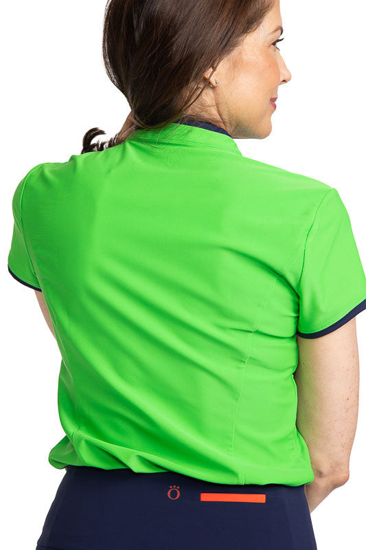 Back view of the Gimme Putt Short Sleeve Golf Top in Fairway Green. This top has navy blue accents around the collar and down the zipper, and around each armhole.