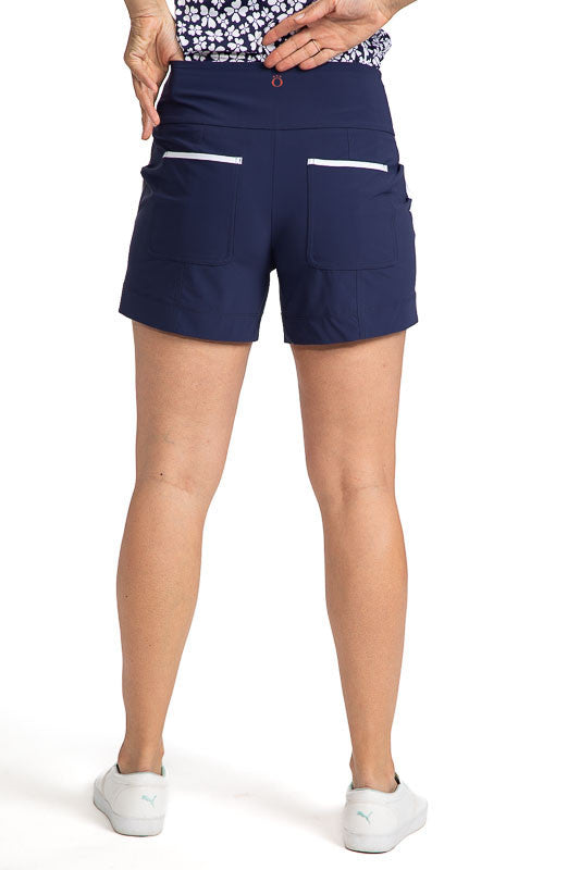Back view of the Carry My Cargo Golf Shorts in Navy Blue/White. These shorts have white trim on both front pockets as well as the back pockets.