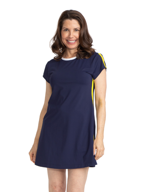 Front view of a woman wearing the Pin High Short Sleeve Golf Dress in navy blue. Women's navy golf dress. 