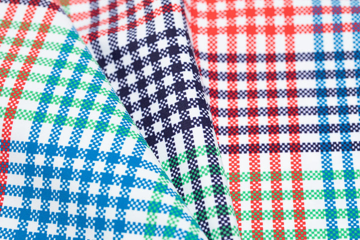 Color swatch - Vacation Plaid. This plaid consists of red, blue, white, and green and is the main color on the body of the Zip it and Rip it Sleeveless Golf Dress
