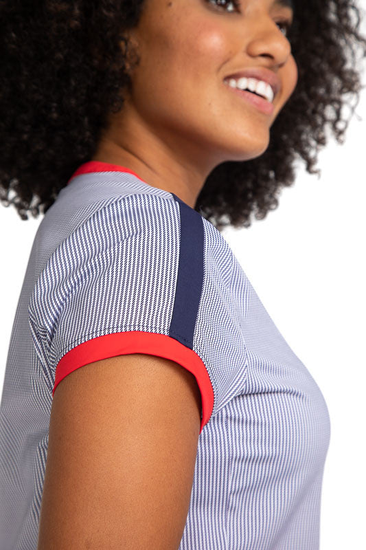 Close right side view of the Approach Shot Short Sleeve Golf Dress in Workin' It Stripe. This stripe pattern consists of navy blue stripes on a white background. There are also cherry red accents around each sleeve and around the neckline with navy blue a