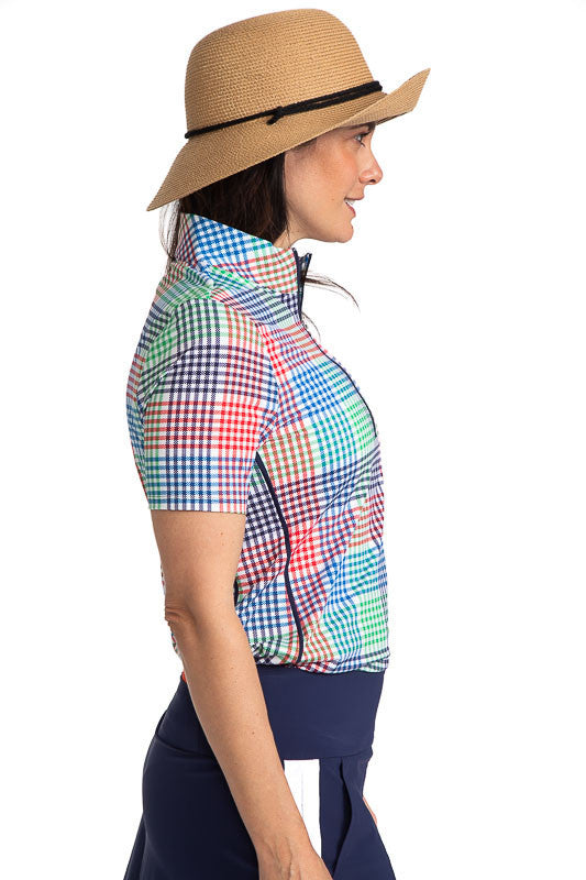 Close right side view of the Keep It Covered Short Sleeve Golf Top in Vacation Plaid. Vacation Plaid consists of a small, checkered pattern of red, blue, green and white.