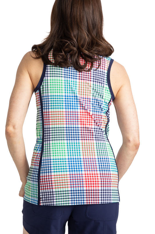 Back view of a woman wearing the Make It Snappy Sleeveless Golf Top in Vacation Plaid. Vacation Plaid consists of a small, checkered pattern of red, blue, green and white. This top has navy blue accents around each arm and two navy blue stripes down each 