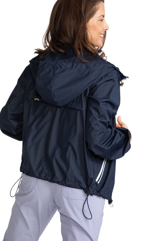 Back view of the Pack and Play Lightweight Golf Jacket in Navy Blue. This jacket folds into a pouch that easily fits in your golf bag.