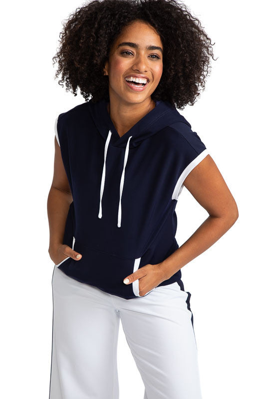 Front view of a smiling woman wearing the Apres 18 Extended Shoulder Hoodie in Navy Blue.