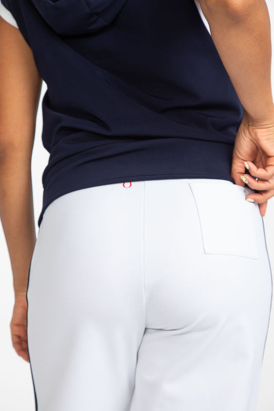Close back view of the  Apres 18 Wide Leg Pants in White. These pants have a navy blue stripe down each side. 