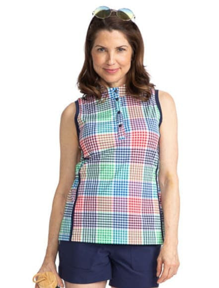 Front view of the Make It Snappy Sleeveless Golf Top in Vacation Plaid. Vacation Plaid consists of a small, checkered pattern of red, blue, green and white. This top has navy blue accents around each arm and two navy blue stripes down each side of this to