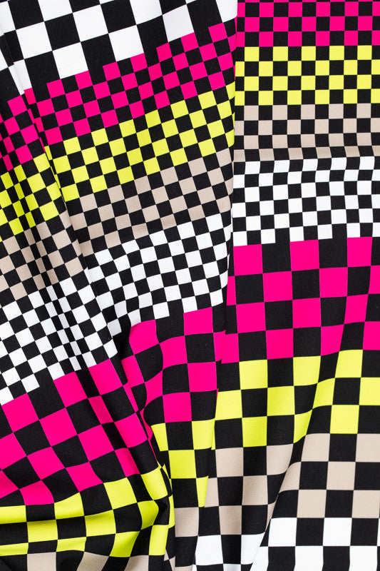 Checks Mix print. This is a checkered print in black squares over wide stripes of white, red, yellow, and sand.