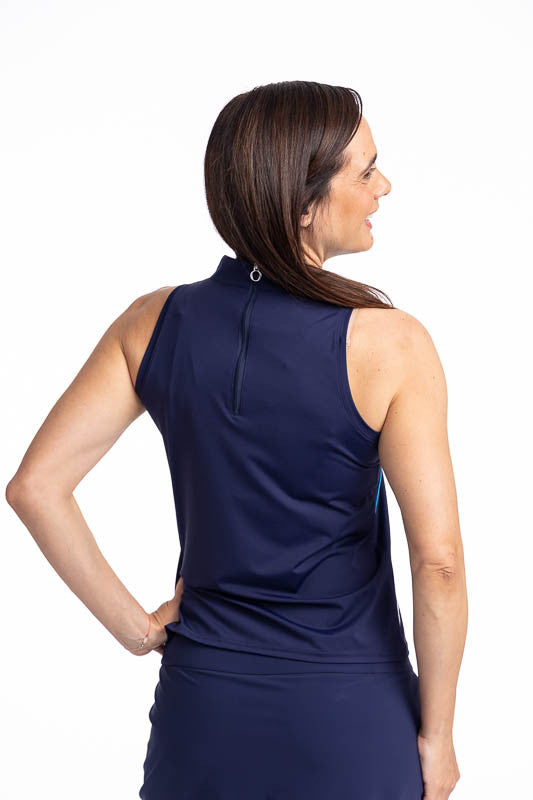 Back view of the Straight Drive Sleeveless Golf Top in Navy Blue. This is a solid navy blue top with four diagonal lines from approximately the middle front of the top down to the hemline in white, pacific blue, white, and coral red.