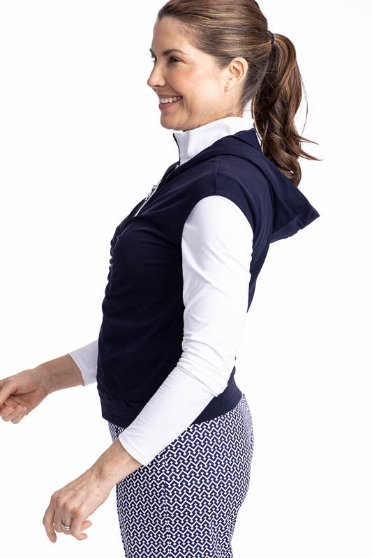 Left side view of the Fall Ball Golf Vest in Navy Blue. This is a solid navy blue vest with a white front zipper and elastic waistband.