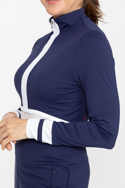 Left side and front view of a woman wearing a Sun's Out Zip Front Shrug in Navy Blue