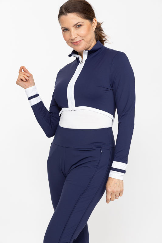 Front view of a woman wearing a Sun's Out Zip Front Shrug in Navy Blue