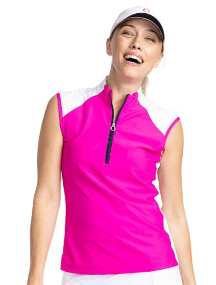 Front view of the Cap to Tap Sleeveless Golf Top in Open Air Pink. This is a bright pink top with white sections on each shoulder and down each side. This top features a front quarter zipper, raglan cap sleeves, and stretch rib sides.