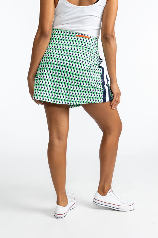 Back view of the Party Pleat Golf Skort in Chevron Kelly Green. This skort has a wide, solid navy blue stripe with a white stripe running down the middle of the navy blue stripe on both sides.