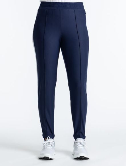Front view of the Ankle Warmer Stirrup Pants in Navy Blue. These pants have a white stripe that runs down each side of the pants.
