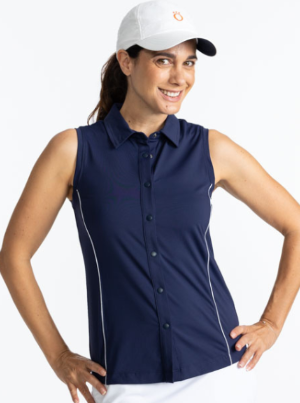 Smiling woman wearing the Dew Sweeper Sleeveless Golf Top in Navy Blue and the We've Got You Covered Hat in White