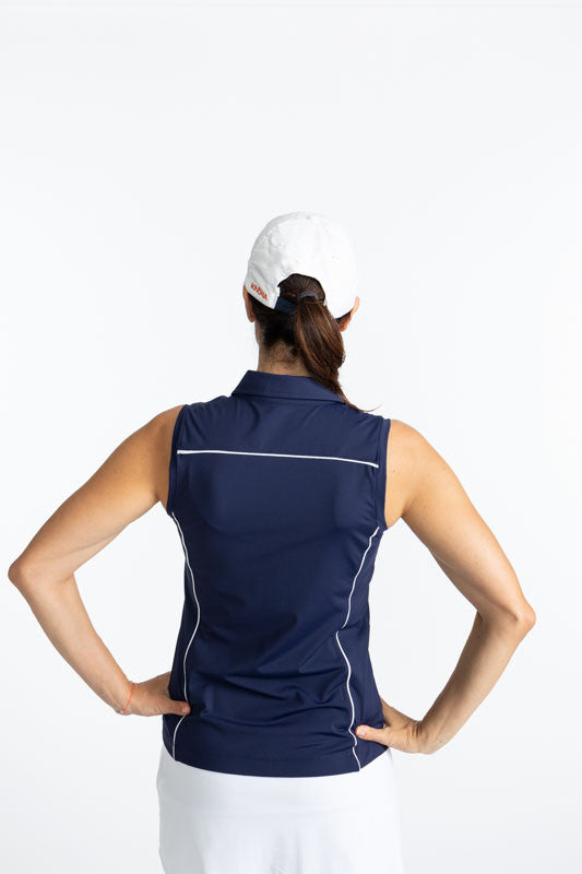 Back view of the Dew Sweeper Sleeveless Golf Top in Navy Blue and the We've Got You Covered Hat in White