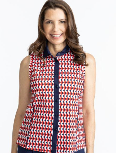 Smiling woman wearing the Dew Sweeper Sleeveless Golf Top in Chevron Tomato Red