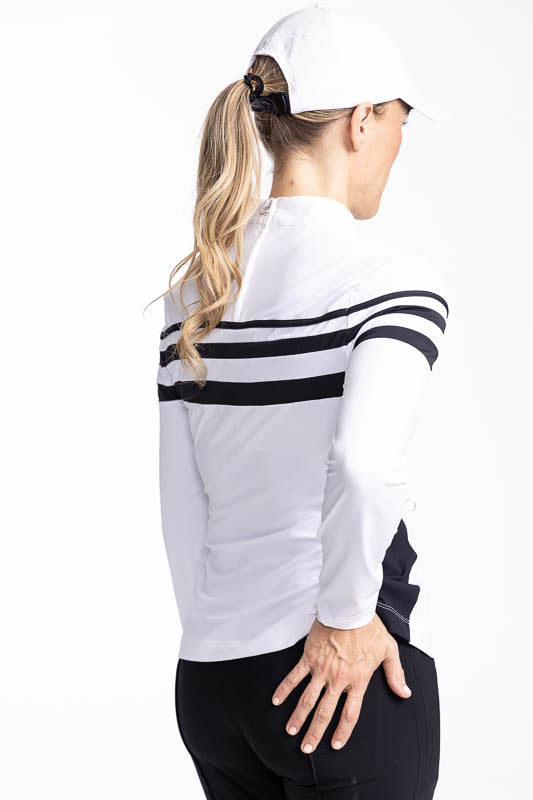 Back view of the Winter Rules Long Sleeve Golf Top in White and the We've Got You Covered Hat in White. This top has three black stripes around the top and one black stripe down each side.