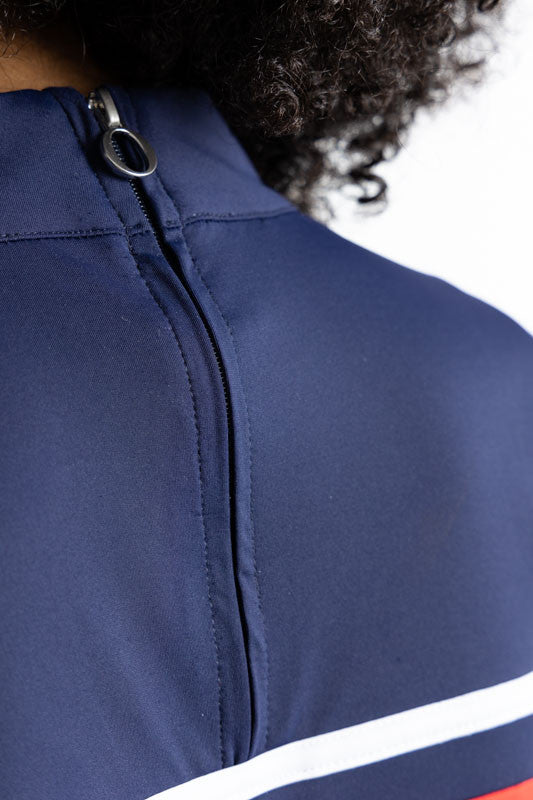 Close back view of the zipper on the Winter Rules Long Sleeve Golf Top in Navy Blue. In this view, you can see the navy blue zipper on the back of this top.