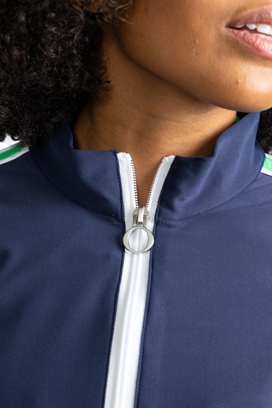 Close front view of the zipper on the Warm Up Jacket in Navy Blue. In this view, you can see the white zipper that runs down the length of the front of this jacket.
