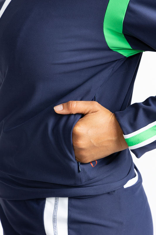 Close left side view of the pocket on the Warm Up Jacket in Navy Blue.