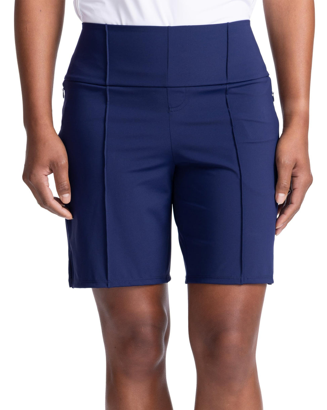 Close up front view of women's medium length golf short in navy