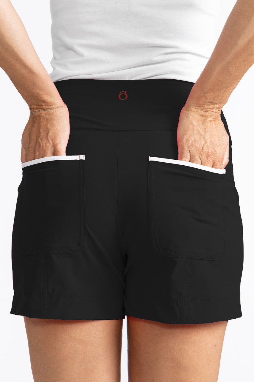 Close back view of the pockets on the Carry My Cargo Golf Shorts in black/white.