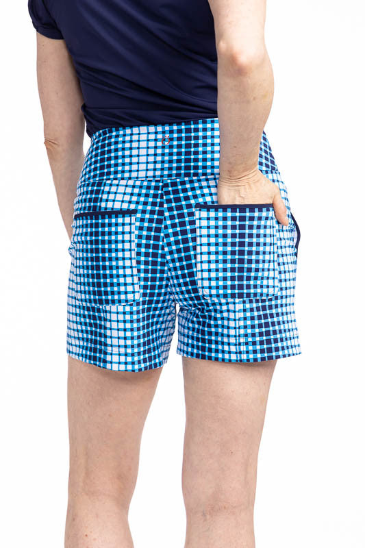 Back view of the Carry My Cargo Golf Shorts in Ocean Plaid. The ocean plaid print is a vertical repeating gradient of white to blue checkered print. 