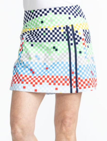 Close front view of the Skort and Short Golf Skort in Cheeky Check print. This print is made up of a checked horizontal patter that creates a horizontal wrap in black, grass green, lemon yellow, French blue, and tomato red on a white background. This skor