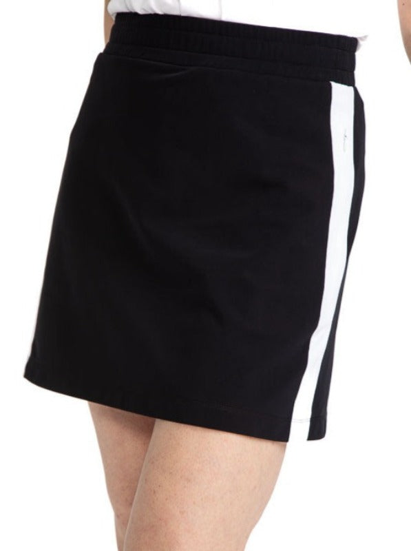 Tight front view of the Apres 18 Sport Skirt in Black. This skirt has a white strip running down each side.