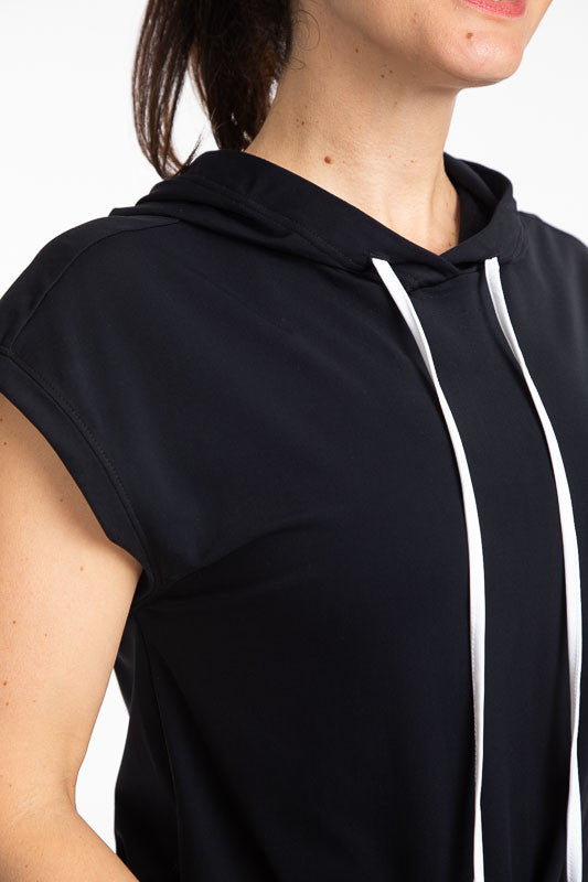Tight front view of the neckline and drawstrings on the Apres 18 Hoodie Dress in Black. This hoodie dress has white drawstrings at the hood and a black drawstring at the waistline.